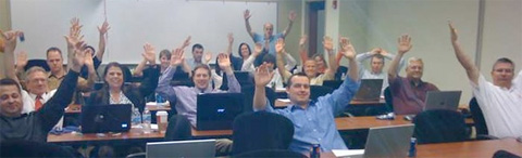 Online Marketing Class Students Raise Their Hands
